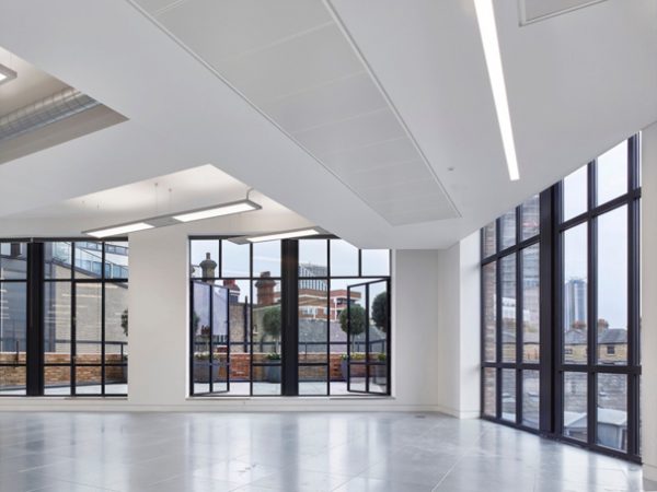 french doors opening onto courtyard with trees and views across London in SE1