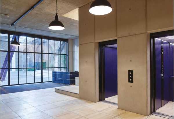 big square tiles into feed into two lifts with controversial purple interiors